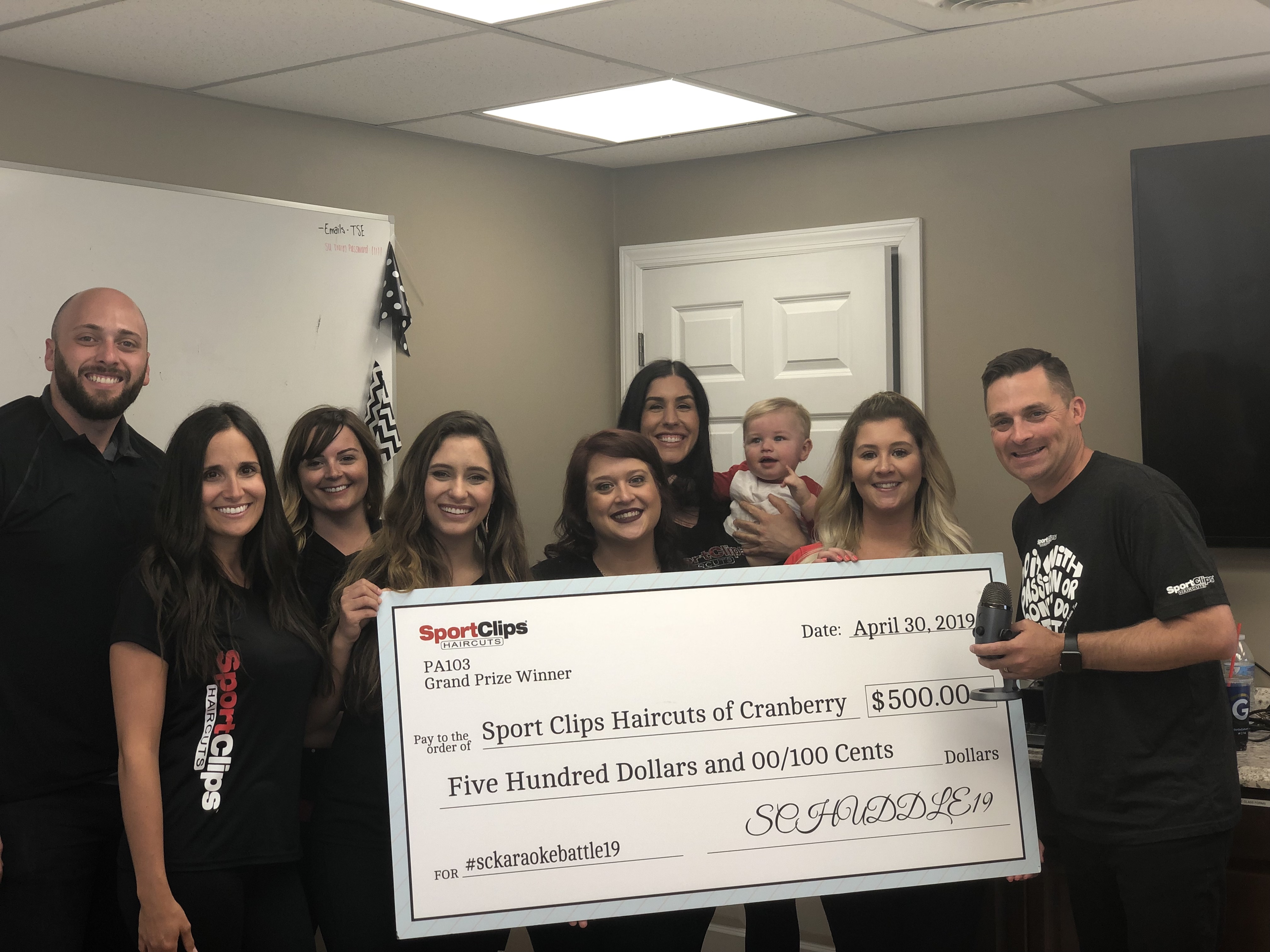 Team Members from PA103 Holding Giant Check and Chad Jordan